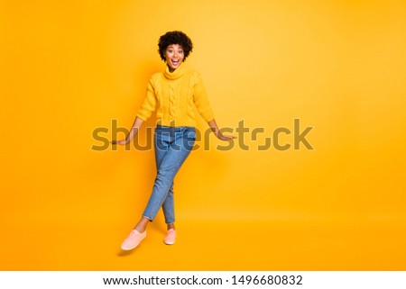 Full length body size photo of cheerful cute attractive funny sweet girlfriend wearing jeans denim pullover dancing isolated over vivid color background