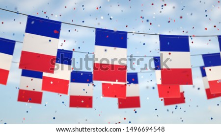 French flags in the sky with confetti.