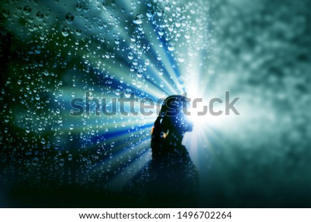 Shadow of women witk light and dew of rain