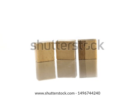 wooden block on top of white background total isolated with reflection. 