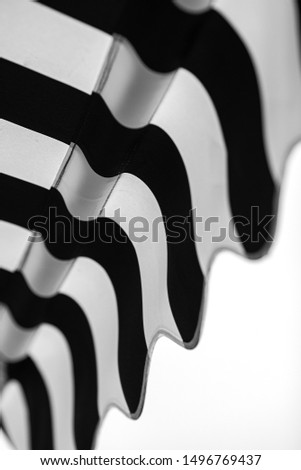 Close up, detail of an awning, black and white stripes