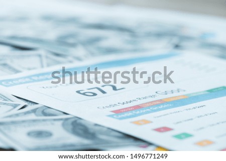 selective focus of paper with credit score lettering on dollar banknotes 