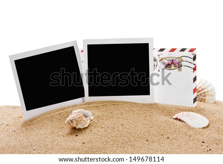 empty photo frame and a letter from vacation in the sand