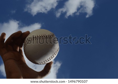 baseball ball with the sky in the background