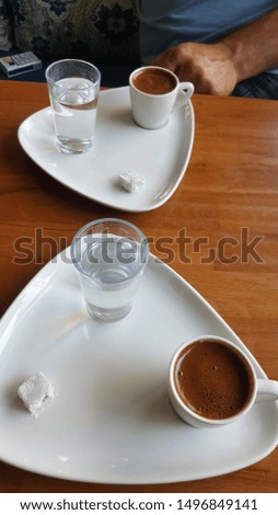 2 Turkish coffee and Turkish delight on wooden table