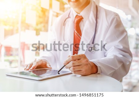 The doctor is advising and advising patients online to allow patients to take care of their health and perform physical examinations according to the doctor's advice when they are far away. Royalty-Free Stock Photo #1496851175