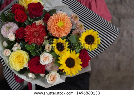 Colorful bouquet with sunflowers, roses, chrysanthemums, dahlias. Bouquet with sunflowers. Flower shop. Florist. Wallpaper. Card.