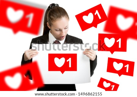 Beautiful girl holding a sheet of white paper in her hands, on a white background, isolated