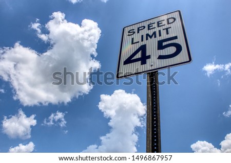 Speed limit 45 sign with clouds Royalty-Free Stock Photo #1496867957
