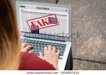 Closeup of young woman reading digital fake news on laptop. Propaganda and disinformation online. Media and digital concept. All screen graphics are made up by us

 Royalty-Free Stock Photo #1496887616