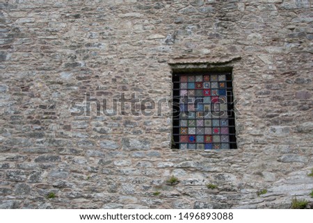 Ireland, Blarney - Colourful stained glass in an old Blarney castle. 