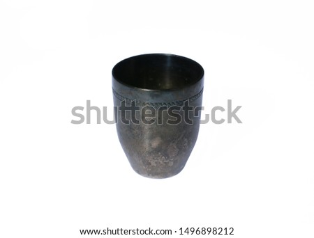 Old metal wine glass isolated on white background