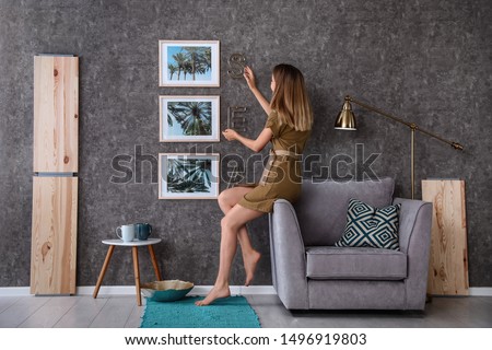 Young interior designer at work in modern room