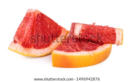 Portion of chopped Grapefruits isolated on white background (close-up shot)