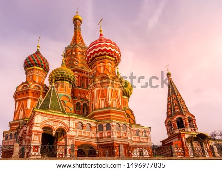 St. Basils Cathedral on the Red Square beautifully highlighted by sun at sunrise, golden hour, Moscow, Russia