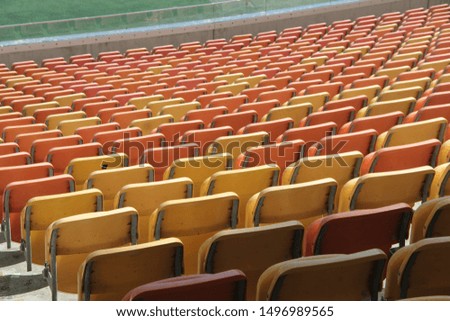 orange chairs in stadium stands