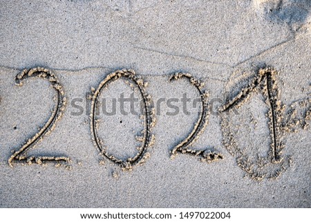 This unique photo shows the 2021 year written in the sand. This picture was taken on an island of the Maldives