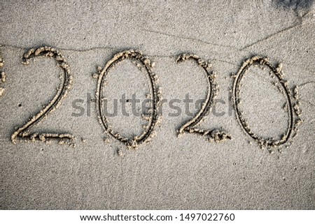 This unique photo shows the 2020 year written in the sand. This picture was taken on an island of the Maldives