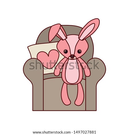 cute rabbit of stuffed with heart love pillows in the sofa