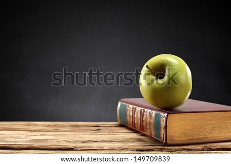 retro book and green apple 