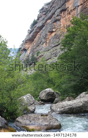 craggy and rocky terrain and small waterfalls,  beautiful alive nature