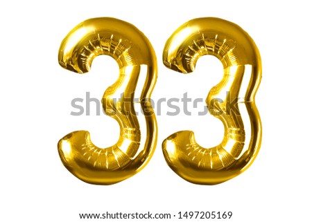 Happy 33 years old party with golden shiny inflatable balloons isolated on white