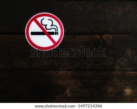 No smoking sign on the old wooden wall
