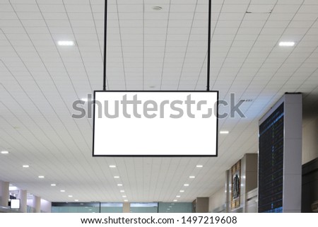 hanging blank advertising billboard or light box showcase on wall at airport