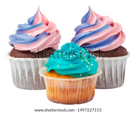 Three yummy cupcakes with icing  isolated on white background