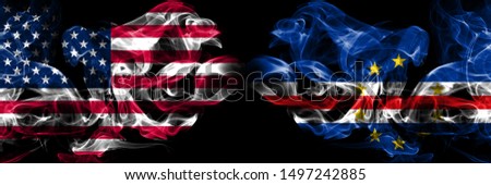 United States of America, USA vs Cape Verde background abstract concept peace smokes flags.