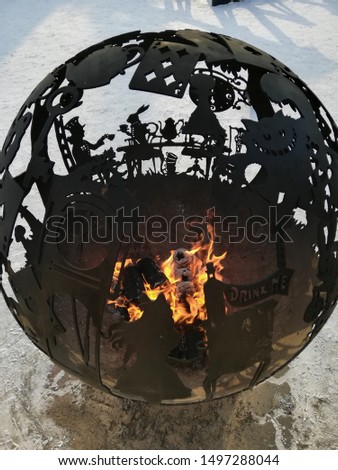 round carved hearth with the characters of Alice