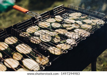 Cabbage on grill.Close-up of raw sliced squash being grilled on outdoors grill equipment.