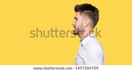 Young handsome business man looking to side, relax profile pose with natural face with confident smile.