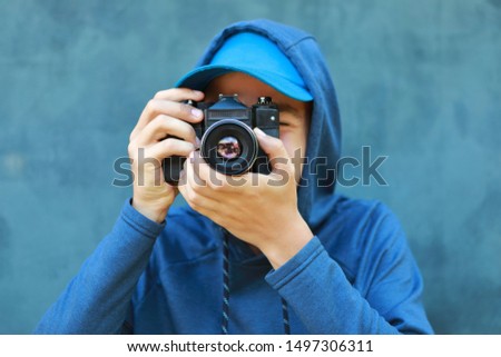 guy photographer with camera in studio