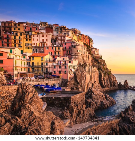 Manarola village on cliff rocks and sea at sunset., Seascape in Five lands, Cinque Terre National Park, Liguria Italy Europe. Long Exposure Photography.