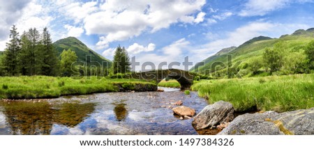Panoramic view of Butter Bridge over Kinglas Water in the Loch Lomond National Park,Scotland Royalty-Free Stock Photo #1497384326