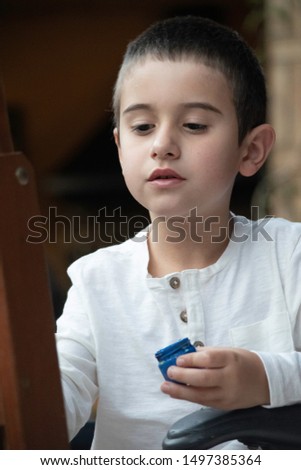 Picture of a boy painting a picture