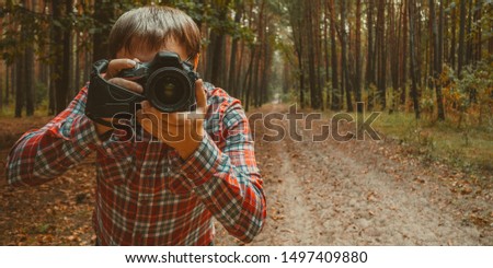 Photographer take a pictures sunrise in forest during hiking