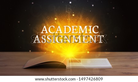 ACADEMIC ASSIGNMENT inscription coming out from an open book, educational concept
