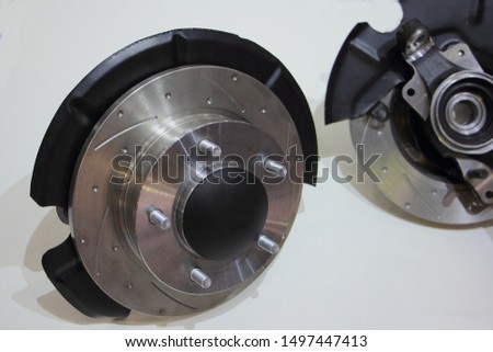 New car wheel hub with brake rotor disk and steering knuckle, vehicle transmission spare parts on white background