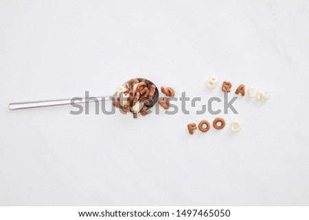 top view of cereal brain food inscription near spoon on marble surface