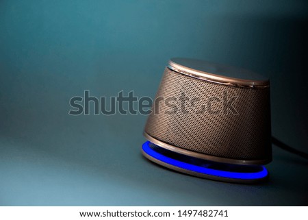 Small speakers USB isolated on blue background.