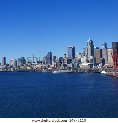 Panorama - Seattle waterfront skyline,with ferry and dockyard cranes,		Puget Sound, 	Pacific Northwest