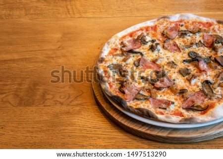 
Delicious pizzas on wooden table