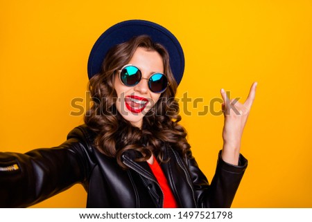 Close up photo of addicted funny heavy metal blogger enjoy party make selfie show two fingers horned signs wear black leather good look outfit isolated over yellow color background