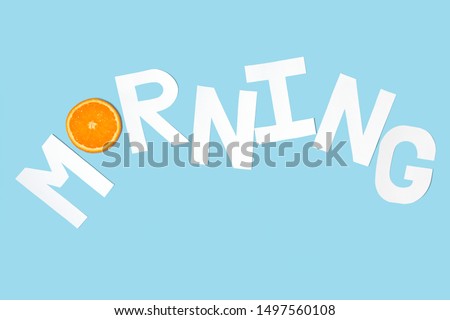Morning text paper cut decorate with orange on pastel blue background
