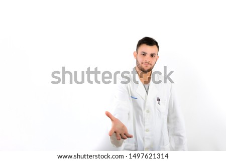 Young male doctor with beard shaking hand isolated on white background 