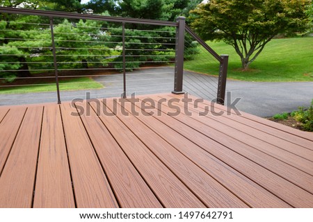 Composite Wood Deck with Metal Railing Royalty-Free Stock Photo #1497642791