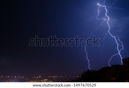 Lightning strike in the city Kyiv.. Storm outside. Thunderstorm with lightning in the city.