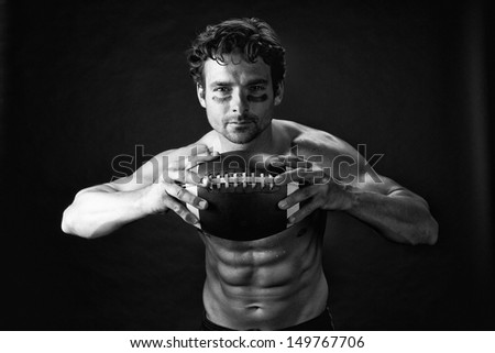 American Football Player with Sweat on Black Background